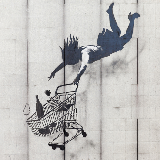 Banksy street art in London titled 'Shop Until You Drop.' This file is licensed under the Creative Commons Attribution-Share Alike 3.0 Unported license.