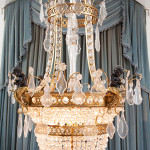 Baccarat glass, gilt and patinated bronze figural chandelier. Heritage Auctions image.
