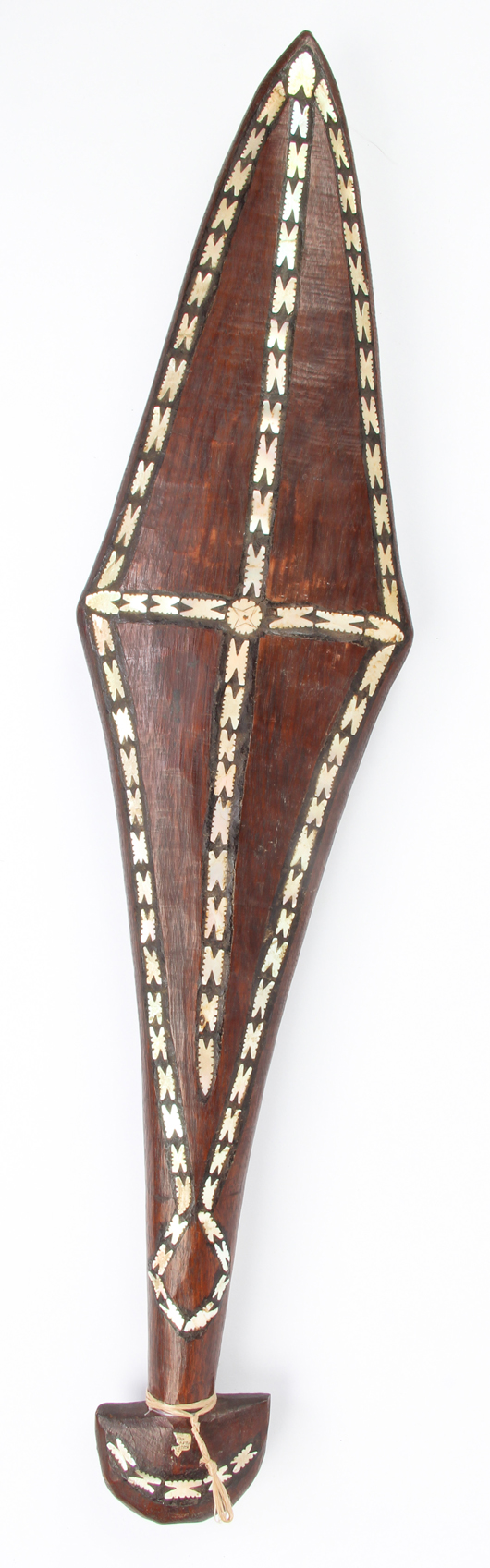 Solomon Islands ceremonial paddle, carved wood inlaid with pearl shell, 28 1/2 x 7 x 1 inches (72 x 18 x 3 cm). Estimate: $1,500-$2,500. Material Culture image.