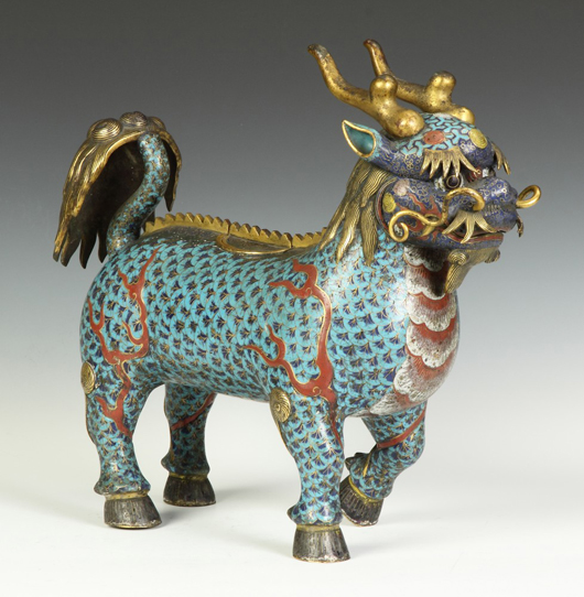 Chinese Kylin standing temple censer, cast bronze with cloisonné and gilt highlights, 15 inches tall. Price realized: $50,600. Cottone Auctions image.