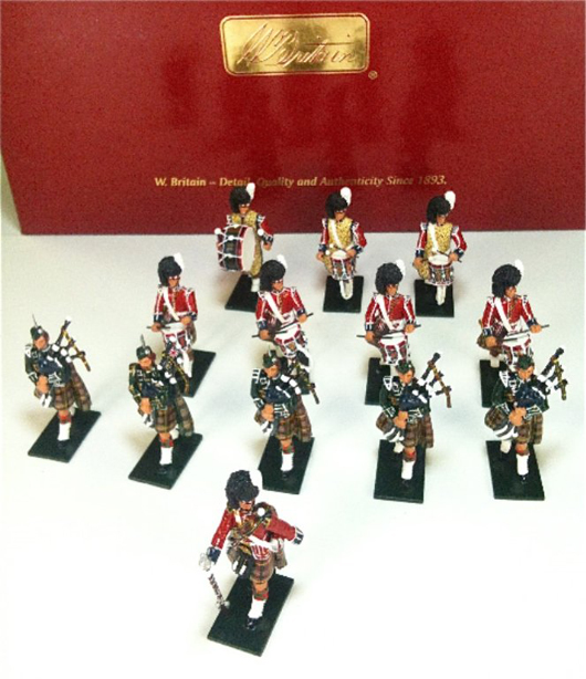 Britains Set #48004, Pipes and Drums of 1st Battalion Queen's Own Cameron Highlanders (79th), 13 pcs. with original box. Est. $60-$80. Old Toy Soldier Auctions image.