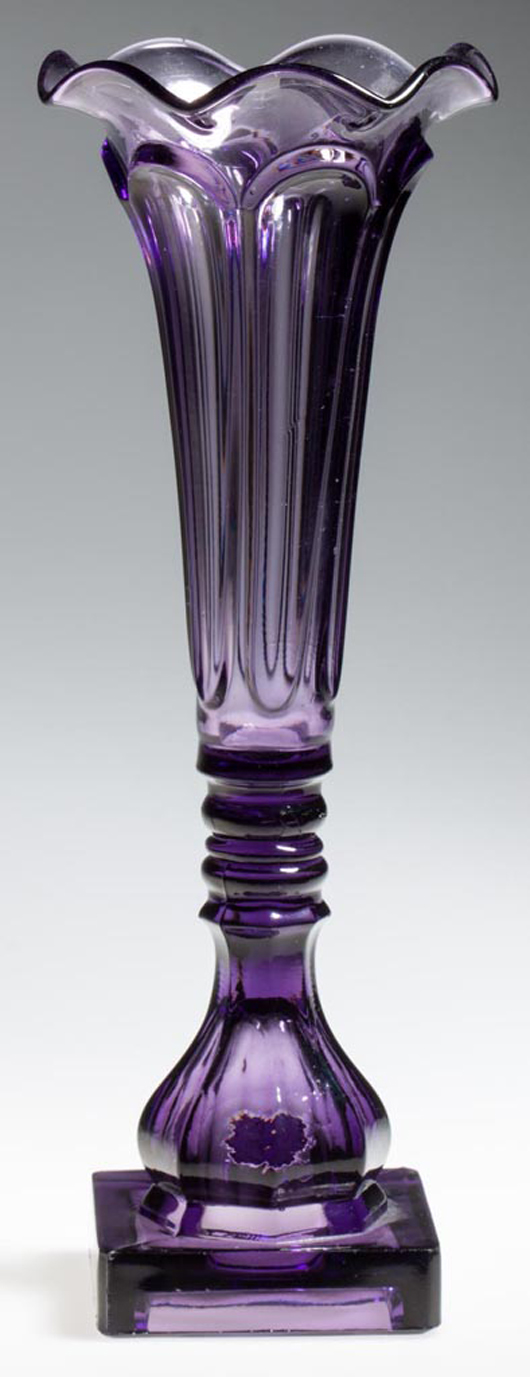 Pressed loop diminutive vase, medium violet, the deep conical bowl with a gauffered, seven-petal rim, probably Boston & Sandwich Glass Co., 1840-1860, sold for $1,610 due to strong demand for its hue, size and shape. Jeffrey S. Evans & Associates image.
