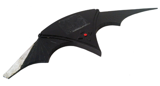 From Tim Burton’s ‘Batman Returns’ (1992), a hero screen-used ‘batarang’ used by Danny DeVito (as the Penguin), to attack the Ice Princess (Cristi Conaway) in her dressing room before the Gotham City Christmas tree lighting ceremony in his attempt to frame Batman. Premiere Props image.
