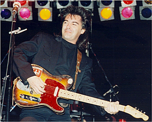 Country music superstar Marty Stuart in a 1993 photo by Alan C. Teeple, licensed under the Creative Commons Attribution-Share Alike 3.0 Unported license.