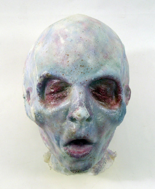 Alien head from the smash hit TV series ‘The X-Files’ (1992-2002), crafted out of latex, and specially painted in ghostly alien colors. Premiere Props image.
