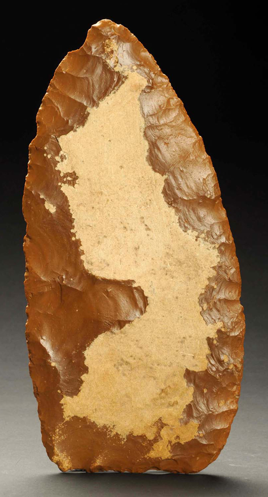 Paleo biface blade, Niobrara tabular chert, ound near Cainsville, Missouri. One of the largest Paleo tools on record. Est. $10,000-$15,000. Morphy Auctions image.