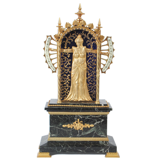 French mechanical ‘Bras en L’aire’ ormolu clock, circa 1890, 18 inches high. Auction Gallery of the Palm Beaches. 