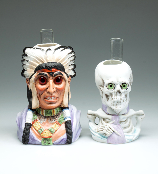 Ceramic figural miniature lamps including a rare American Indian chief from the Hulsebus collection. Jeffrey S. Evans & Associates image.