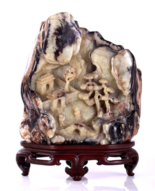 Lot 18: 17th/18th century Chinese carved, pale celadon, brown and russet Jade mountain. Gray’s Auctioneers and Appraisers image.