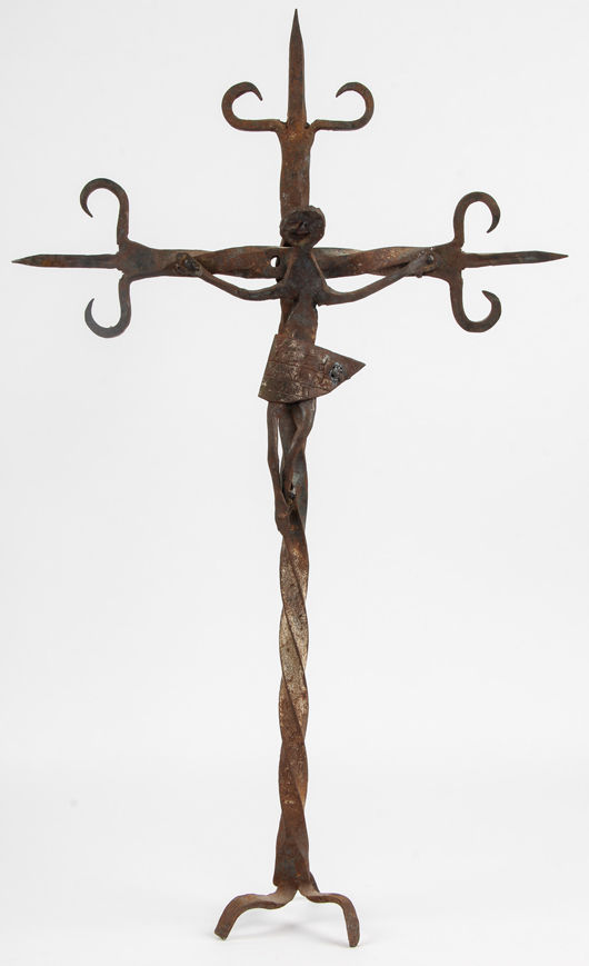 Lot 4: Georges Liautaud (Haitian, 1889-1991) ‘Christ on Cross,’ circa 1960s, forged iron. Signed. Size: 36 x 22 x 7 inches. Estimate: $2,000-$4,000. Material Culture image.