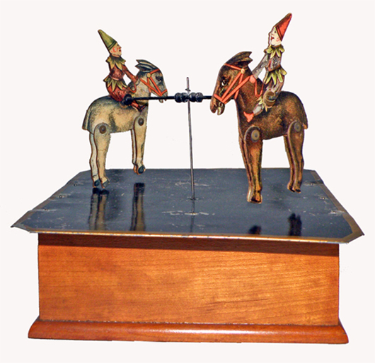 1875 Ives mechanical Revolving Mule Dancers, only known complete example. Mosby & Co. image.