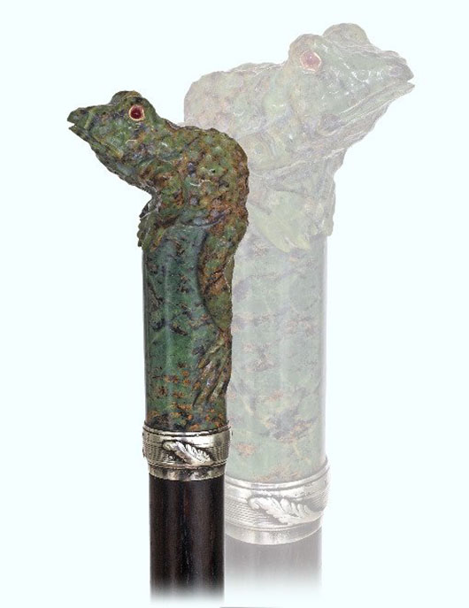 Jade figural cane, late 19th or early 20th century, large mottled jade frog on a plinth handle, ruby cabochon eyes in gold framing, silver collar, rosewood shaft and a horn ferrule. This cane is in the taste of Carl Faberge and has possible Russian ties. Estimate: $4,000-$6,000. Kimball M. Sterling Inc. image.q