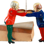 The two papier-mache and wood figures wrestling with the help of some strings depict 19th-century politicians who couldn't agree on anything. The toy and original box sold for $180 at Jackson's Auctions in Cedar Falls, Iowa. Most people today would not recognize the pair, Disraeli and Gladstone, as famous British politicians during the reign of Queen Victoria.