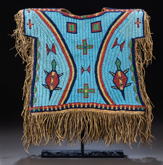 Sioux boy's pictorial beaded and fringed hide shirt, circa 1875, with ink inscription on the front interior: ‘Captured on June 25, 1876 at the Battle with Indians on the Little Big Horn River, M.T. Commanded by General G. A. Custer, U.S.A. by Louis Rott 1st Sgt., Co. K, 7th Cav.’ Estimate: $30,000-$50,000. Heritage Auctions image.