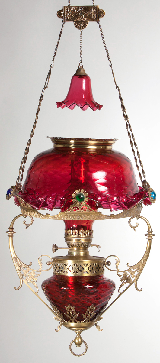 Lot 568: Charles Parker Starpoint Petticoat brass-frame hanging library lamp, cranberry with fuchsia highlights. Price realized: $4,025. Jeffrey S. Evans & Associates image.