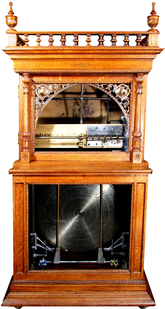 Gorgeous Regina coin-operated music disc changer, #45766, complete with discs. Price realized: $10,800. Showtime Auction Services image.