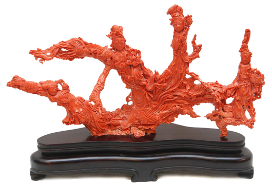Antique Qing Dynasty period Chinese hand-carved red coral sculpture depicting four Guan Yin. Price realized: $66,550. Elite Decorative Arts image.