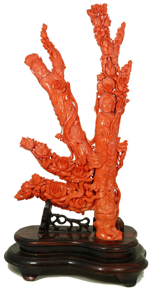Chinese hand-carved red coral figural group depicting two Guan Yin with flowers throughout. Price realized: $66,550. Elite Decorative Arts image.