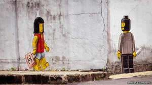 This photo of Ernest Zacharevic's mural in Singapore was widely shared through social media before authorities ordered the artwork to be painted over. Image courtesy of Ernest Zacharevic.