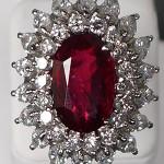 Platinum cocktail ring comprising a 9.91-carat, GIA-certified oval ruby surrounded by 18 round diamonds (approx. 2.21 cts) and 18 marquise-cut diamond (4.16 cts). Est. $12,000-$18,000. Sterling Associates image.
