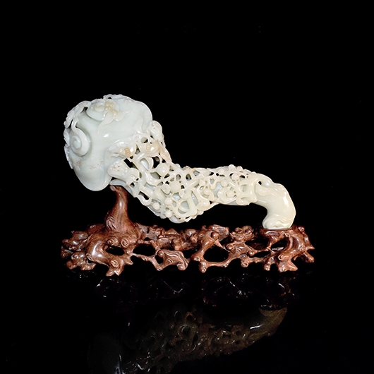 Carved massive Hetian white jade ruyi scepter in the form of a Lingzhi Fungus, Qing Dynasty, Kangxi. Estimate: $50,000-$60,000. Gianguan Auctions image.