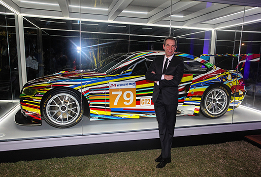 Jeff Koons and his Art Car. Image courtesy of BMW.