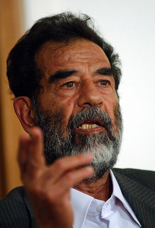 Saddam Hussein at a pretrial hearing. U.S. Department of Defense photo, courtesy of Wikimedia Commons.