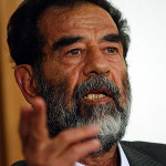 Saddam Hussein at a pretrial hearing. U.S. Department of Defense photo, courtesy of Wikimedia Commons.