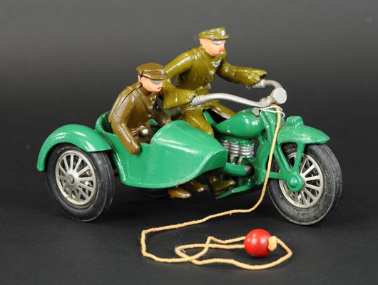 Vindex cast-iron motorcycle and sidecar, production run of less than two years, 8½ in, green with khaki driver and rider. Sold for $25,960. Bertoia Auctions image.