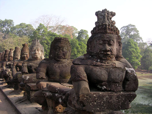 Asuras hold the nāga Vasuki on a bridge leading into Angkor Thom in Cambodia. Image by Yosemnite 13:01. This file is licensed under the Creative Commons Attribution-Share Alike 3.0 Unported License.