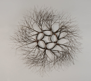 Ruth Lanier Asawa, wire sculpture, tied wire branching wall mounted wreath. Price realized: $102,660. Michaan's Auctions image.
