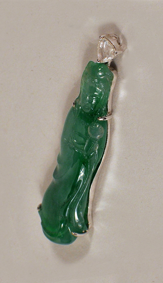 Chinese gold jade pendant. Price realized: $4,250. Woodbury Auction image.