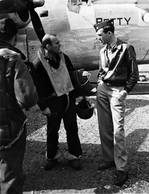 Maj. Jimmy Stewart, right, confers with a B-24 crew member in 1943. U.S. Air Force Image courtesy of Wikimedia Commons.