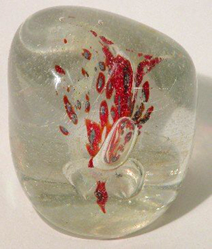 Glass paperweight by Vernon Brejcha, clear glass with red and blue highlighted inclusions in interior with miniature controlled bubble pattern, signed on side, circa 1970, 2 3/4 inches high. Image courtesy of LiveAuctioneers.com Archive and Bunte Auction Services Inc.