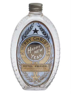‘A Merry Christmas, Happy New Year, Hotel Emrich, 485 to 489 Pennsylvania Ave., Washington, D.C.’ is the wording on the label under glass on this antique holiday gift flask. It once held a half pint of whiskey. The bottle sold for $468 at an online Norman C. Heckler bottle auction.