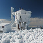 The Mount Washington Observatory summit weather station coated in a thick layer of rime ice, which forms when fog freezes. With an average annual temperature of just 27 degrees and cloud cover two-thirds of the time, Mount Washington has prolific rime icing much of the year. Mount Washington Observatory image.