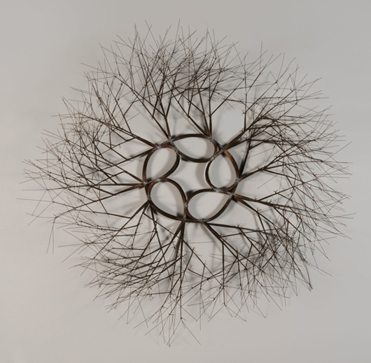 Ruth Lanier Asawa (Californian, 1926-2013), ‘Wire Sculpture,’ tied wire branching wall mounted wreath. Sold for $102,660. Michaan’s Auctions image.