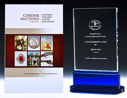 ‘Best in Show’ award and award-winning brochure. Image courtesy Cordier Auctions.