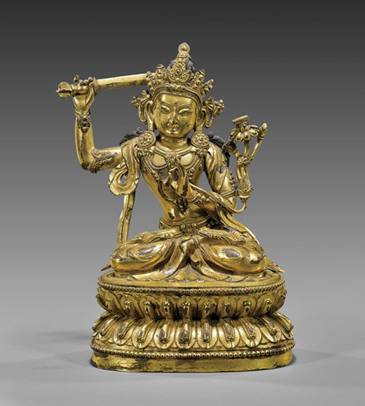 Finely cast Sino-Tibetan gilt bronze seated deity, probably of the White Tara, 6 3/4 inches. Estimate: $3,500-$4,000. I.M. Chait Gallery /Auctioneers image.