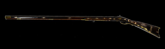 Kentucky rifle, circa 1835, inlaid with profuse engraved silver depictions, est. $8,000-$12,000. Louis J. Dianni LLC image.