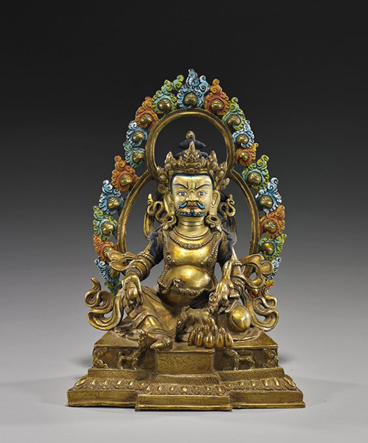 Elaborate Nepalese/Tibetan gilt bronze deity. I.M. Chait Gallery / Auctioneers image.