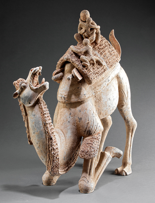Rare and monumental Chinese painted pottery figural group of a Bactrian camel, probably Tang Dynasty (618-907). Estimate: $40,000-$60,000. Neal Auction Co. image.