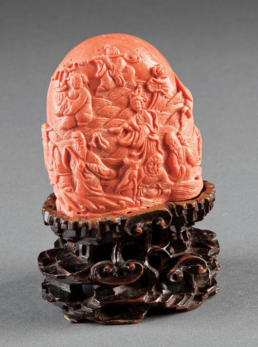 Rare Chinese ‘coral’ glass Eight Immortals scholar's mountain, probably Qing Dynasty (1644-1911), 5 1/4 inches overall. Estimate: $15,000-$25,000. Neal Auction Co. image.