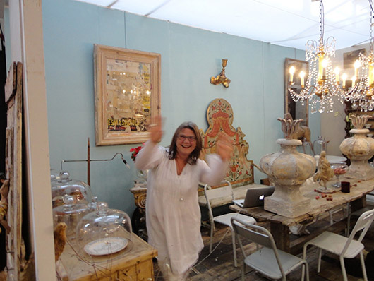 London-based decorative interiors dealer Josephine Ryan at the recent Decorative Antiques and Textiles Fair in Battersea Park. Image Auction Central News.