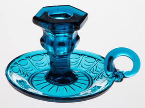 Lot 11: pressed Eye and Scale hand candlestick/chamberstick, brilliant deep peacock-blue, circa 1830-1850, Boston & Sandwich Glass Co. Price realized: $9,775. Jeffrey S. Evans & Associates image.