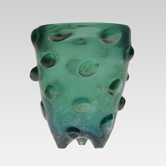 This deep green vase with an iridized corroso surface is decorated with bugne or bosses in relief. The circa 1935 work, signed inside the lip ‘Venini Murano,’ sold for $30,000 last year in Chicago. Courtesy Wright Auctions.