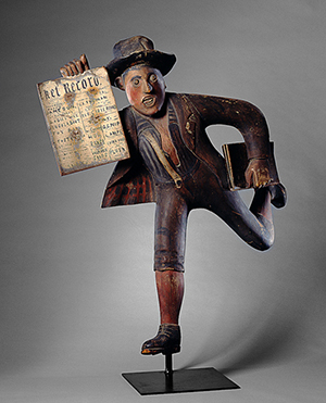 American 'The Newsboy,' 1888, carved, assembled and painted wood with folded tin 42 x 20 x 11 in., Milwaukee Art Museum, The Michael and Julie Hall Collection of American Folk Art M1989.125 Photo credit John Nienhuis.