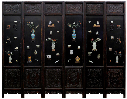This Chinese six-panel inlaid lacquer screen with various scholar’s items and bouquets of flowers in jade, stone, wood and cloisonné inlay, is estimated at $10,000-$20,000. Clars Auction Gallery image.