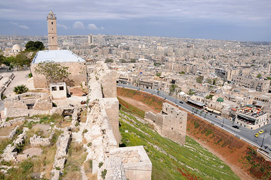 Aleppo from the Citadel, the medieval fortified palace in the centre of the old city in northern Syria. Image by anjci. This file is licensed under the Creative Commons Attribution 2.0 Generic license.