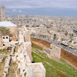 Aleppo from the Citadel, the medieval fortified palace in the centre of the old city in northern Syria. Image by anjci. This file is licensed under the Creative Commons Attribution 2.0 Generic license.